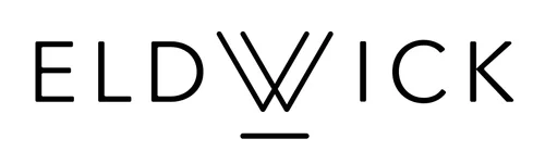 Eldwick logo in modern black typography featuring geometric ‘W’ created by intersecting double ‘V’ lines and a short horizontal bar beneath. Minimalist brand identity design emphasising symmetry, balance, and simplicity.