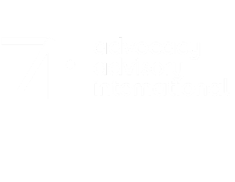 Advocacy Advisory International logo, stylized geometric orange symbol resembling number '7' or upward arrow on left, lowercase orange text on right reading 'advocacy advisory international' in modern sans-serif font, transparent background, minimalist global branding identity.